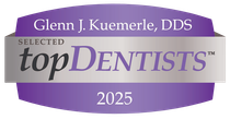 A purple and silver badge reading: Glenn J. Kuemerle, DDS, Selected topDENTISTS, 2025.