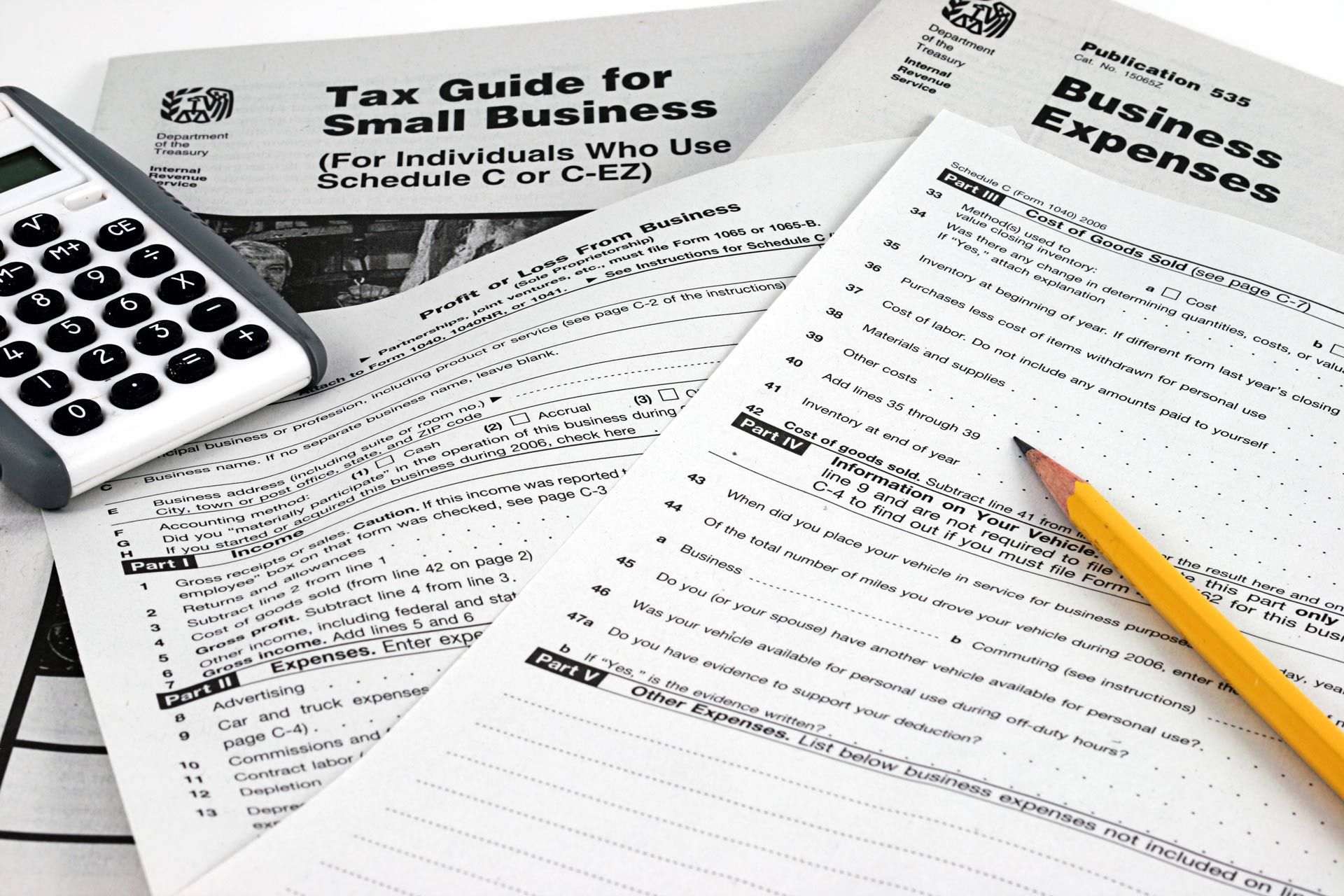 Close-up of different sheets used for business tax preparation. Close-up of different sheets used for business tax preparation.