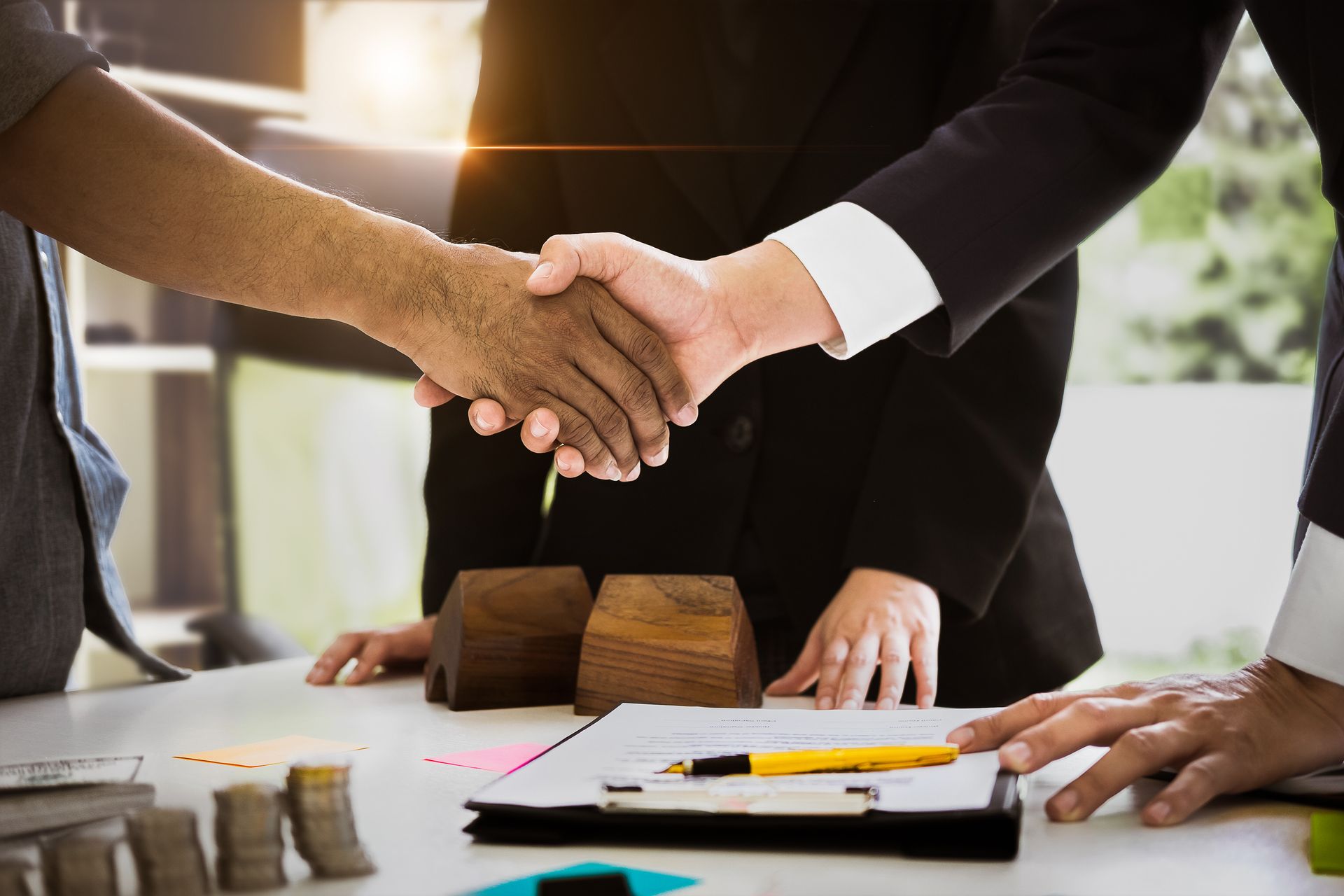 Client and agent shake hands, showcasing trust, representing certified public accountant services. Client and agent shake hands, showcasing trust, representing certified public accountant services.