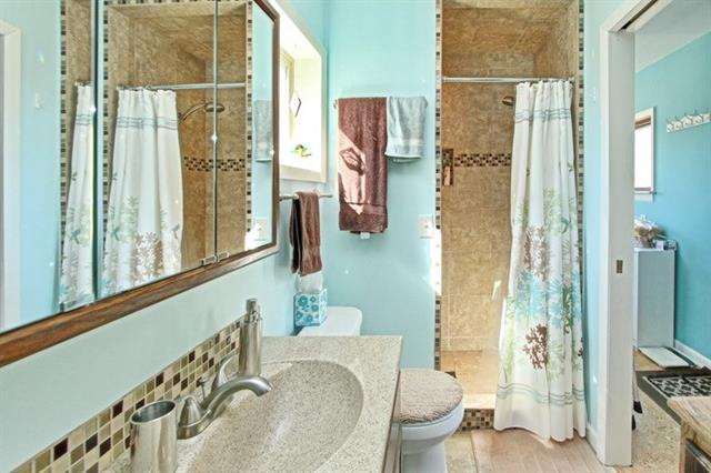green comfort room with mirror