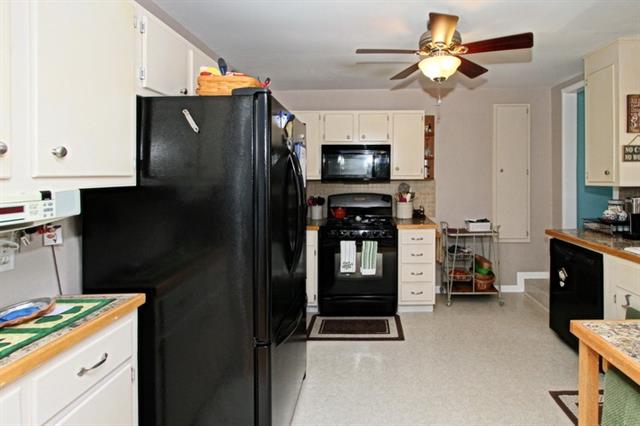 kitchen with black refrigerator