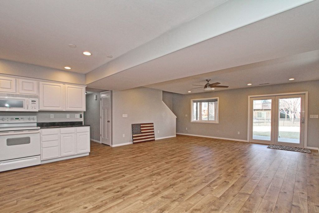white kitchen with wooden tiles