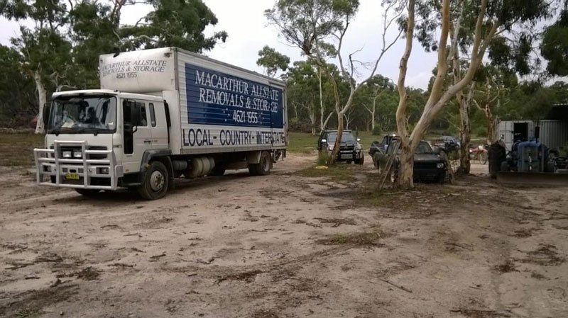 company truck in a dirt parking lot
