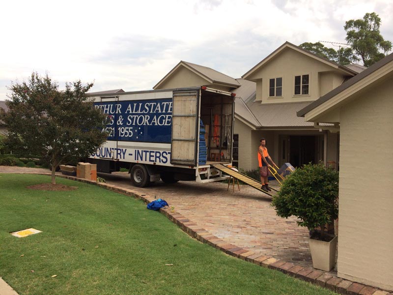 man removing items from truck