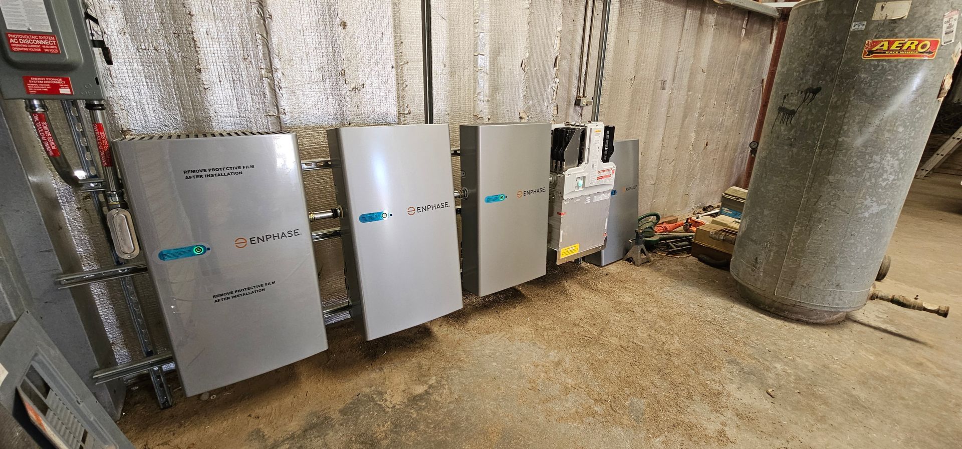 A room with a lot of electrical boxes on the wall.