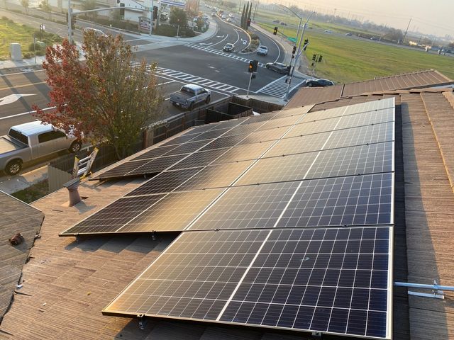 A roof with a lot of solar panels on it