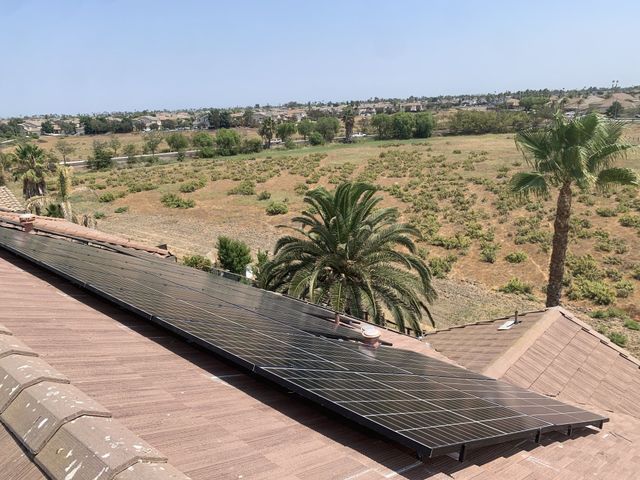 A roof with a lot of solar panels on it