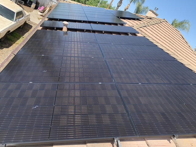 A roof with a lot of solar panels on it