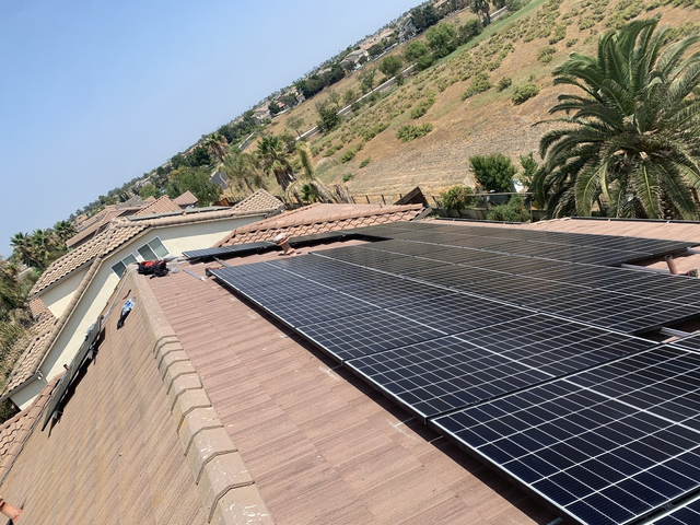 A roof with a lot of solar panels on it