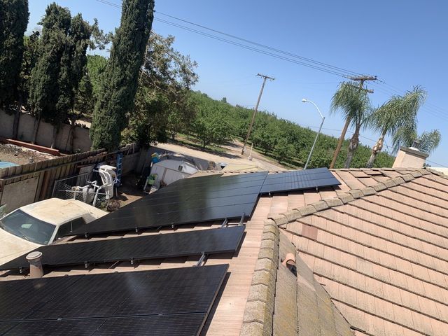 A roof with a lot of solar panels on it