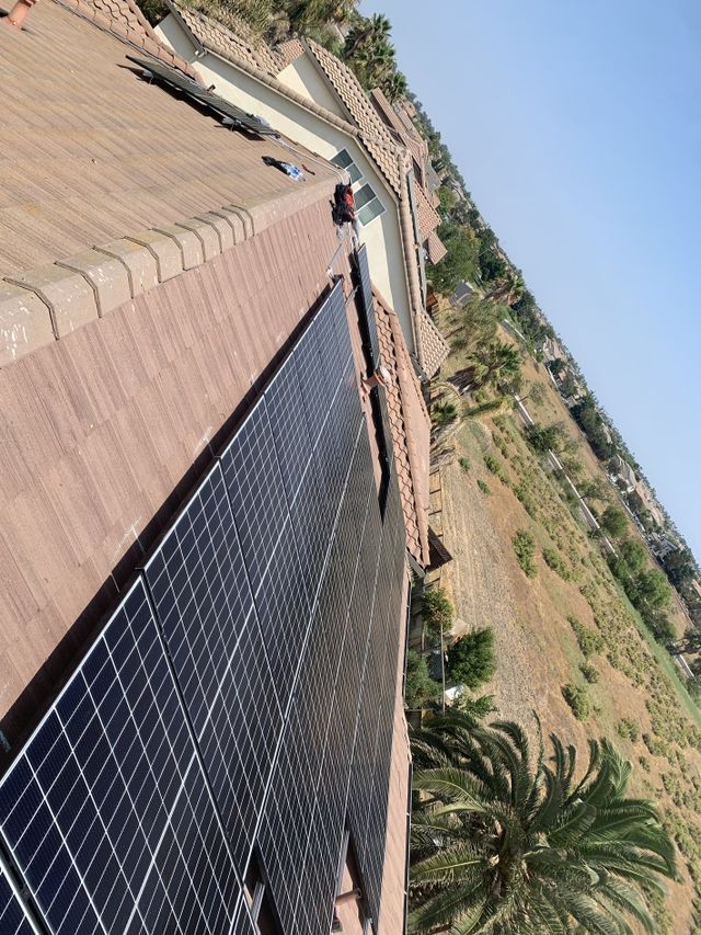 A roof with a lot of solar panels on it