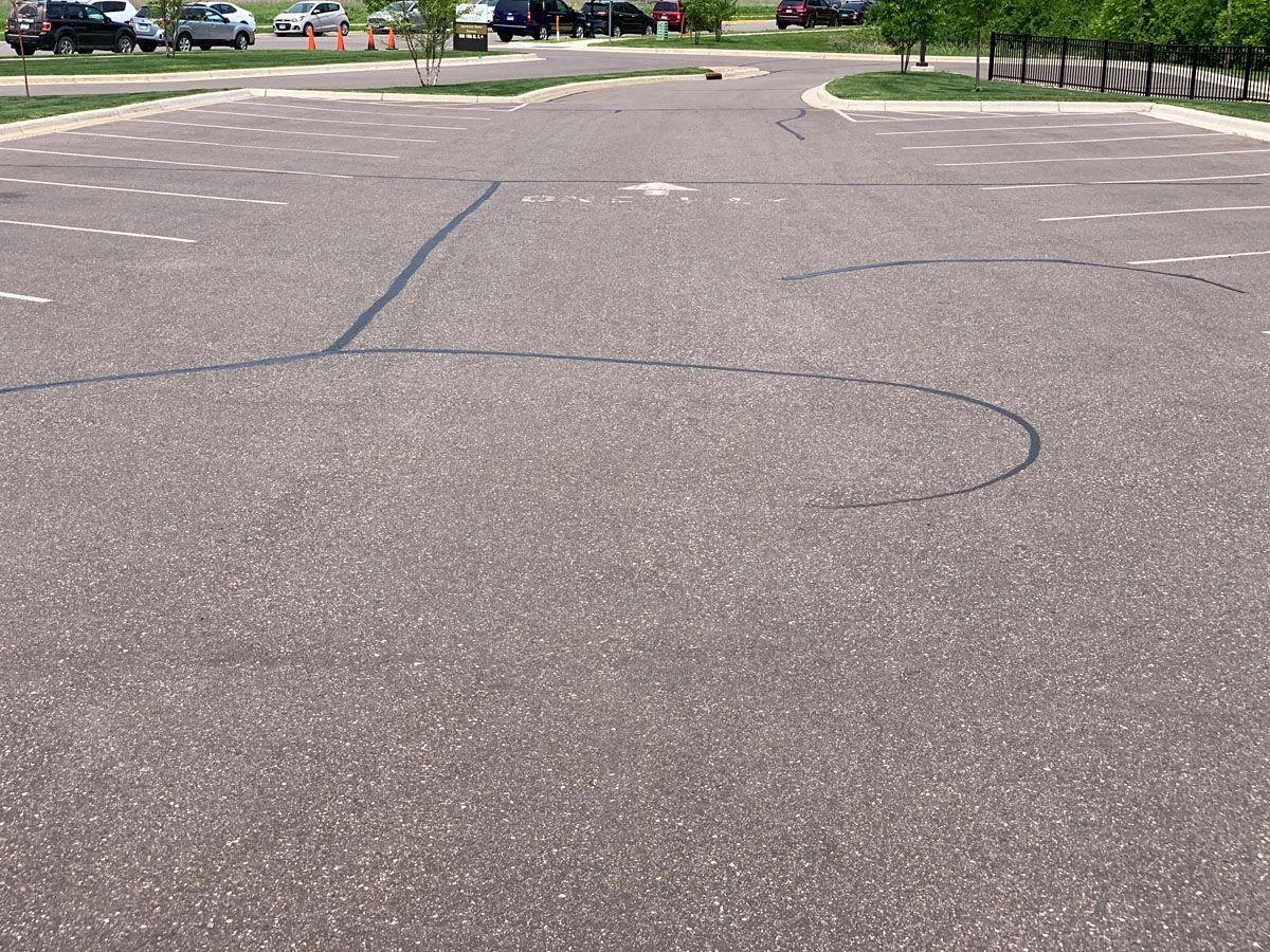 A parking lot with a circle drawn in the middle of it