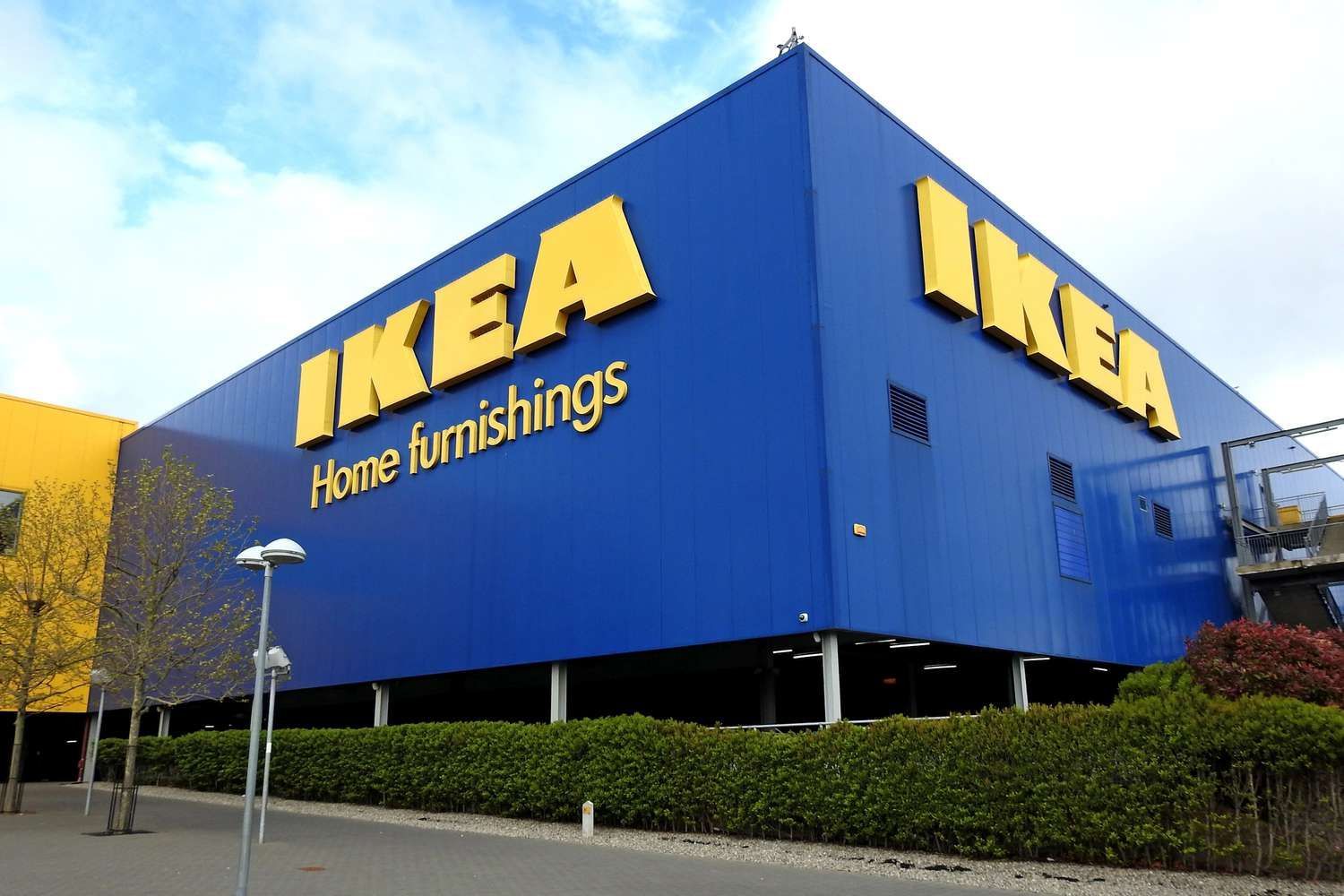 A large blue and yellow building that says ikea home furnishings
