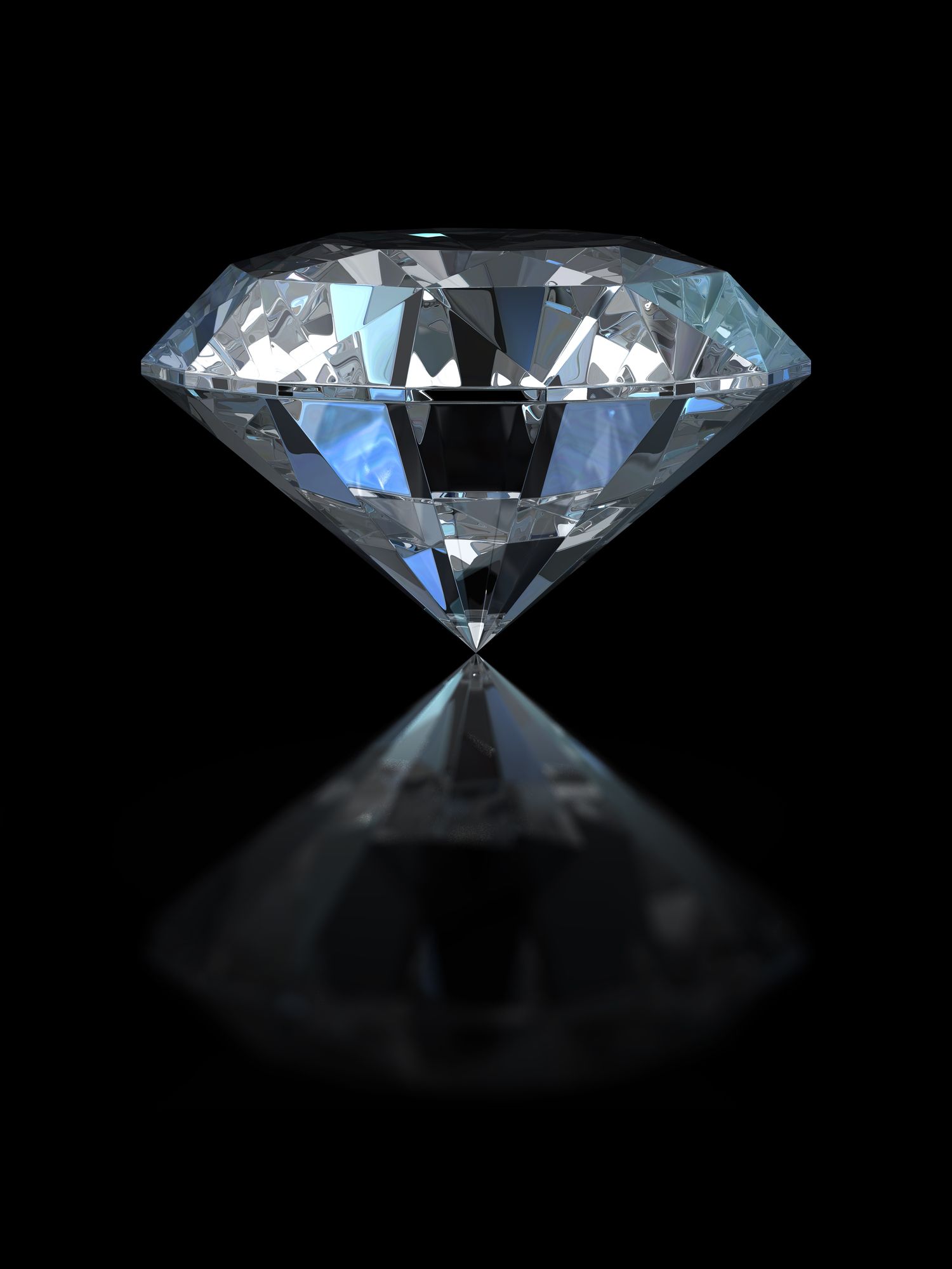 Sparkling diamond against a black background with a reflection.