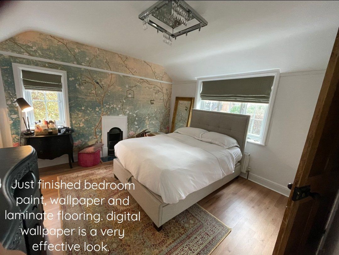 Finished bedroom paint, wallpaper and laminate flooring. The digital wallpaper is a classy touch.