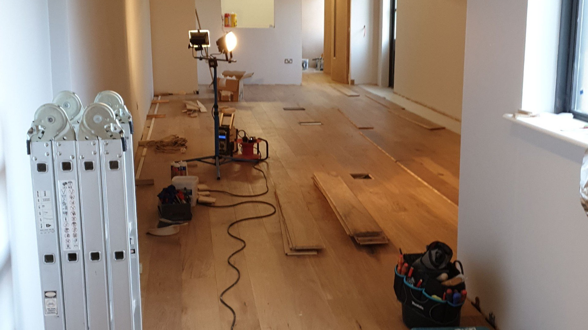 In the middle of laying hardwood flooring