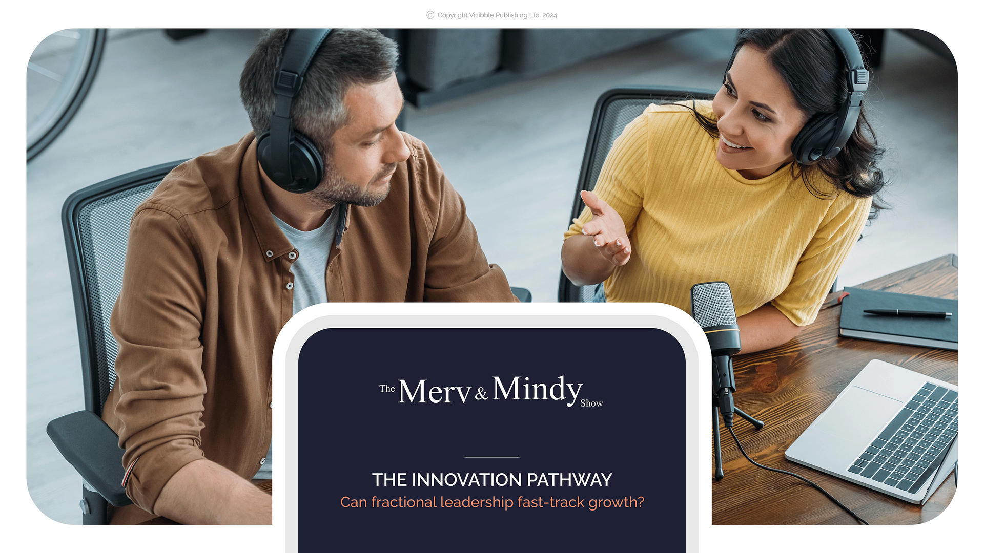 Man and woman in headphones, recording a podcast in a studio.