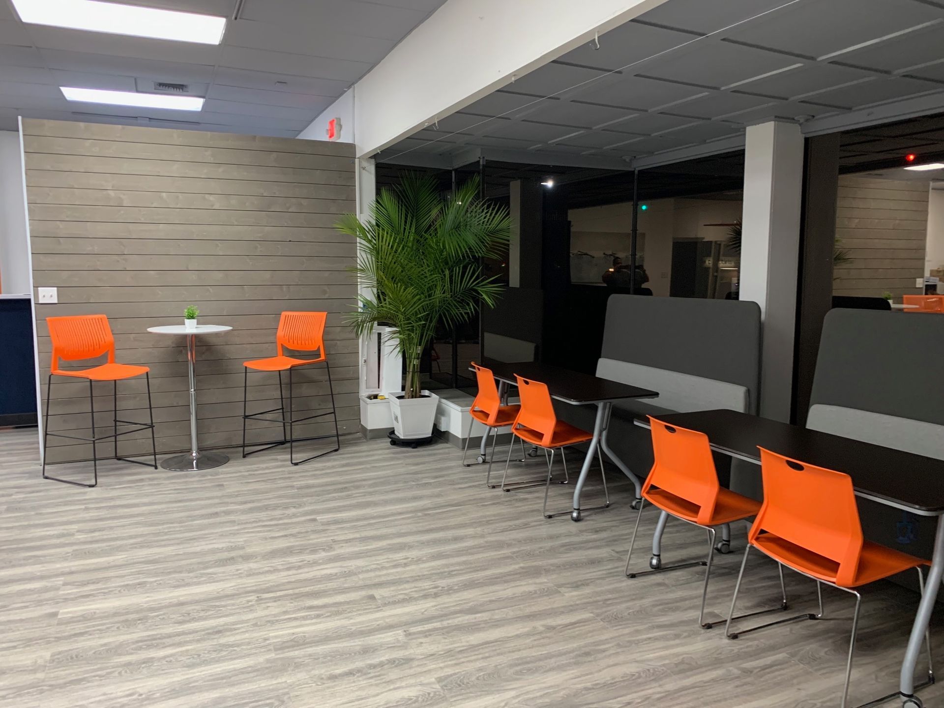 A large room with tables and chairs in it.