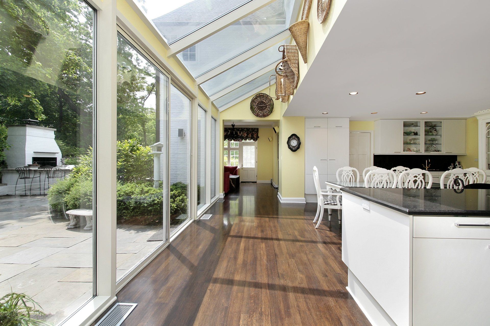 A kitchen with hardwood floors and a glass ceiling
