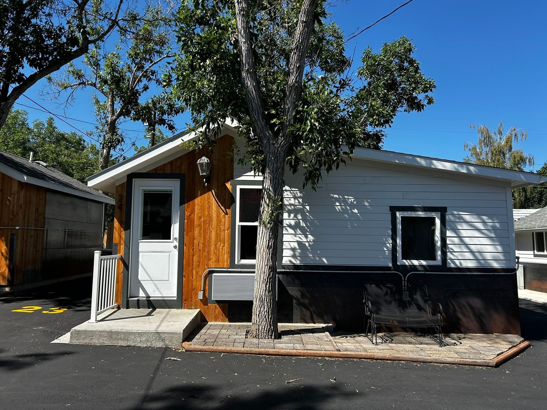 A hotel room with a king size bed , a couch , and a coffee table.