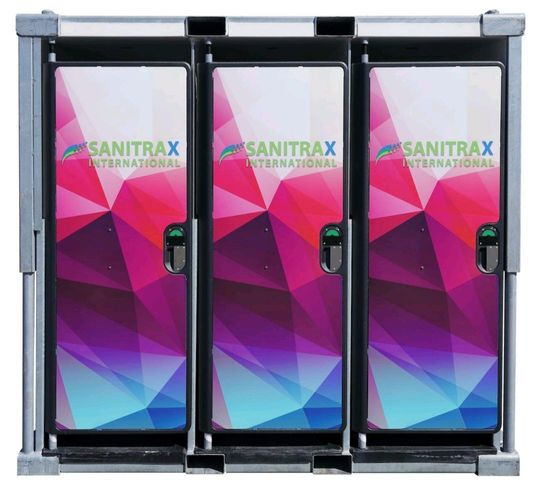 A row of sanitrax international portable toilets