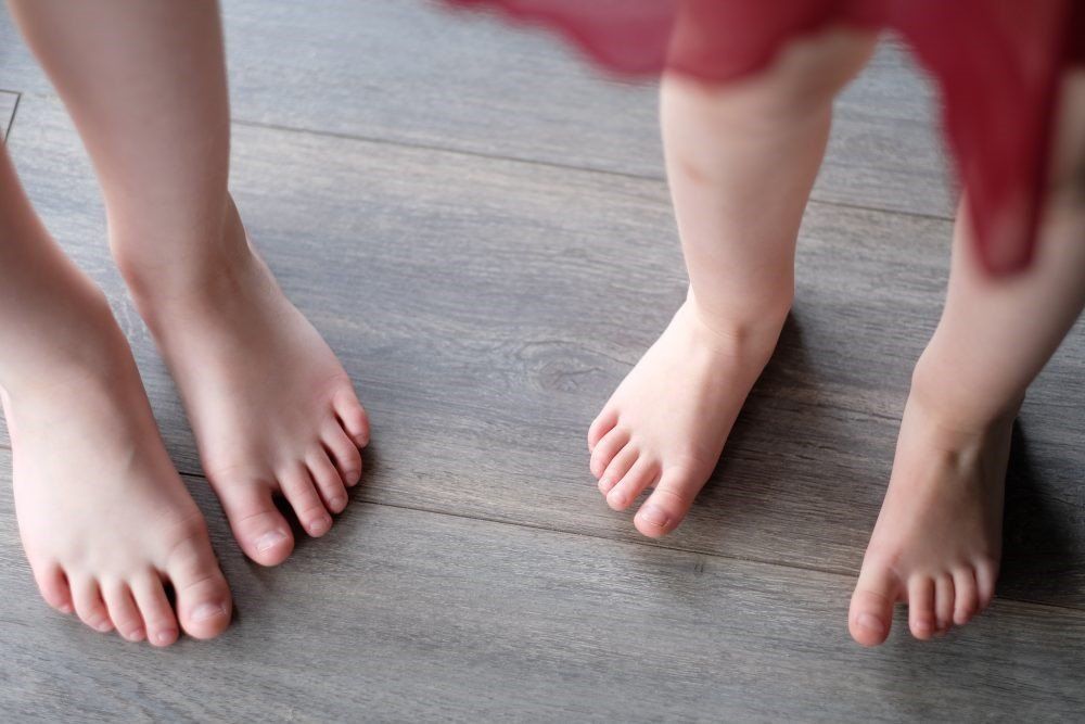 Feet on wooden floor creating impact noise