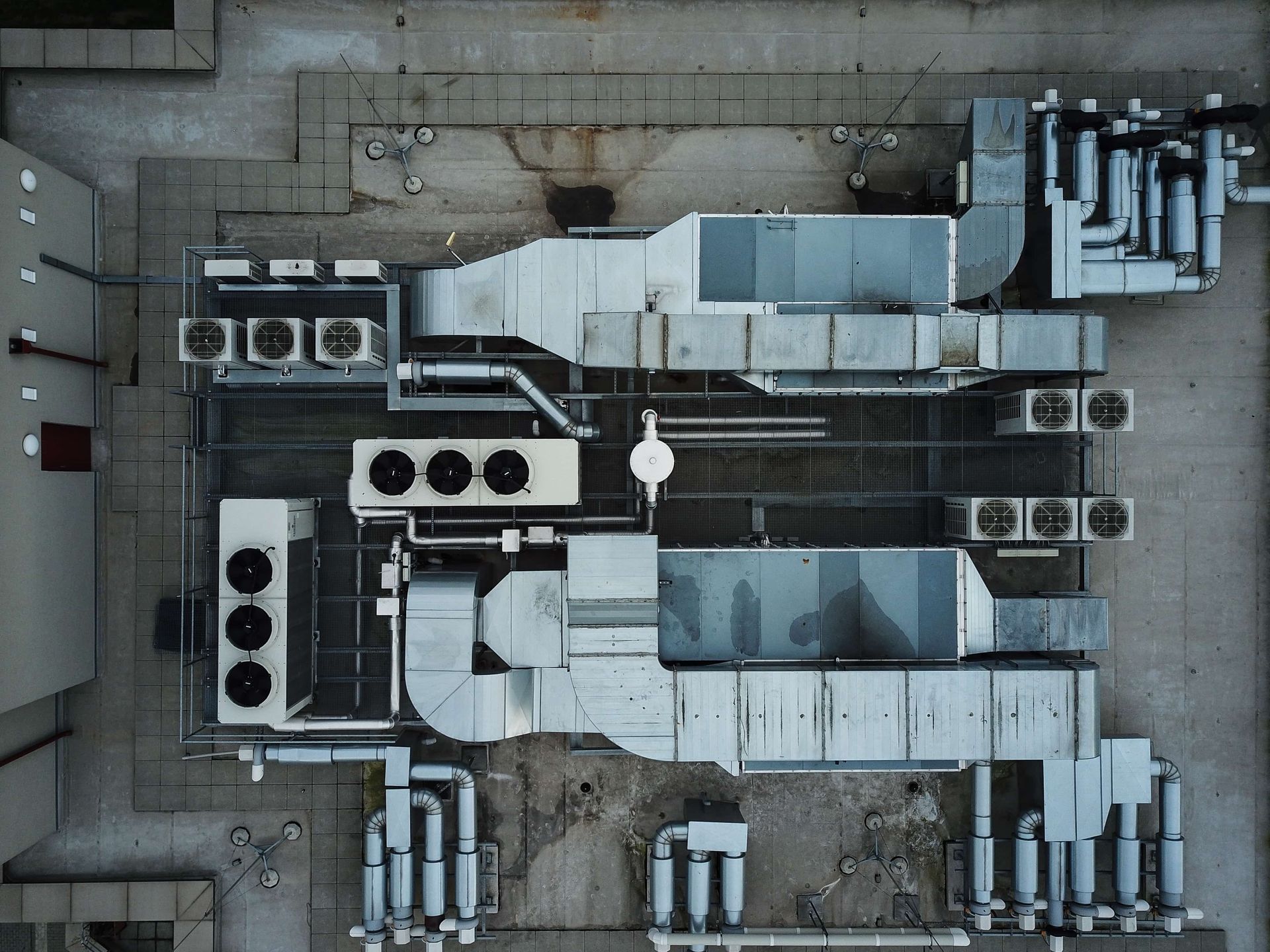 An aerial view of a building with a lot of pipes.