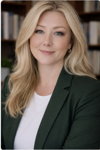 Sheryl Davis Matthews. Blonde woman smiling, wearing a black blazer and white shirt.