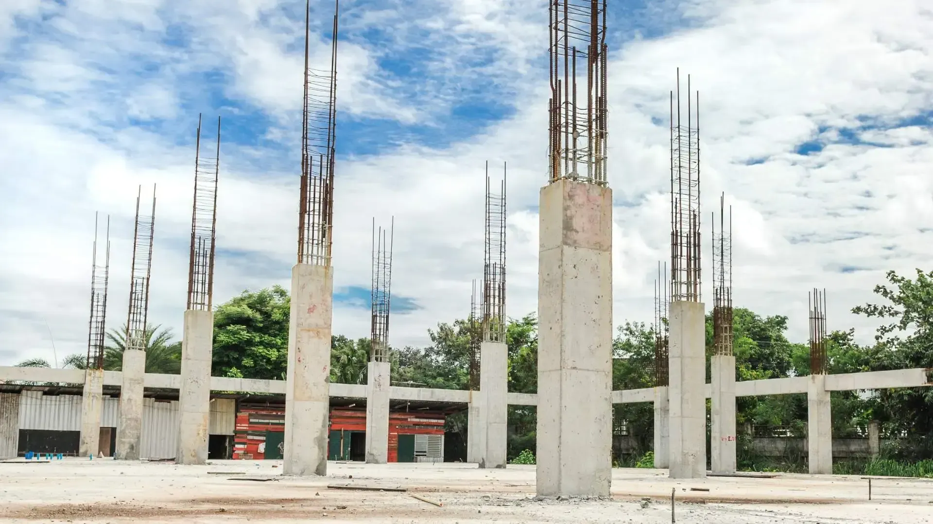 Foundational concrete piles with exposed rebar