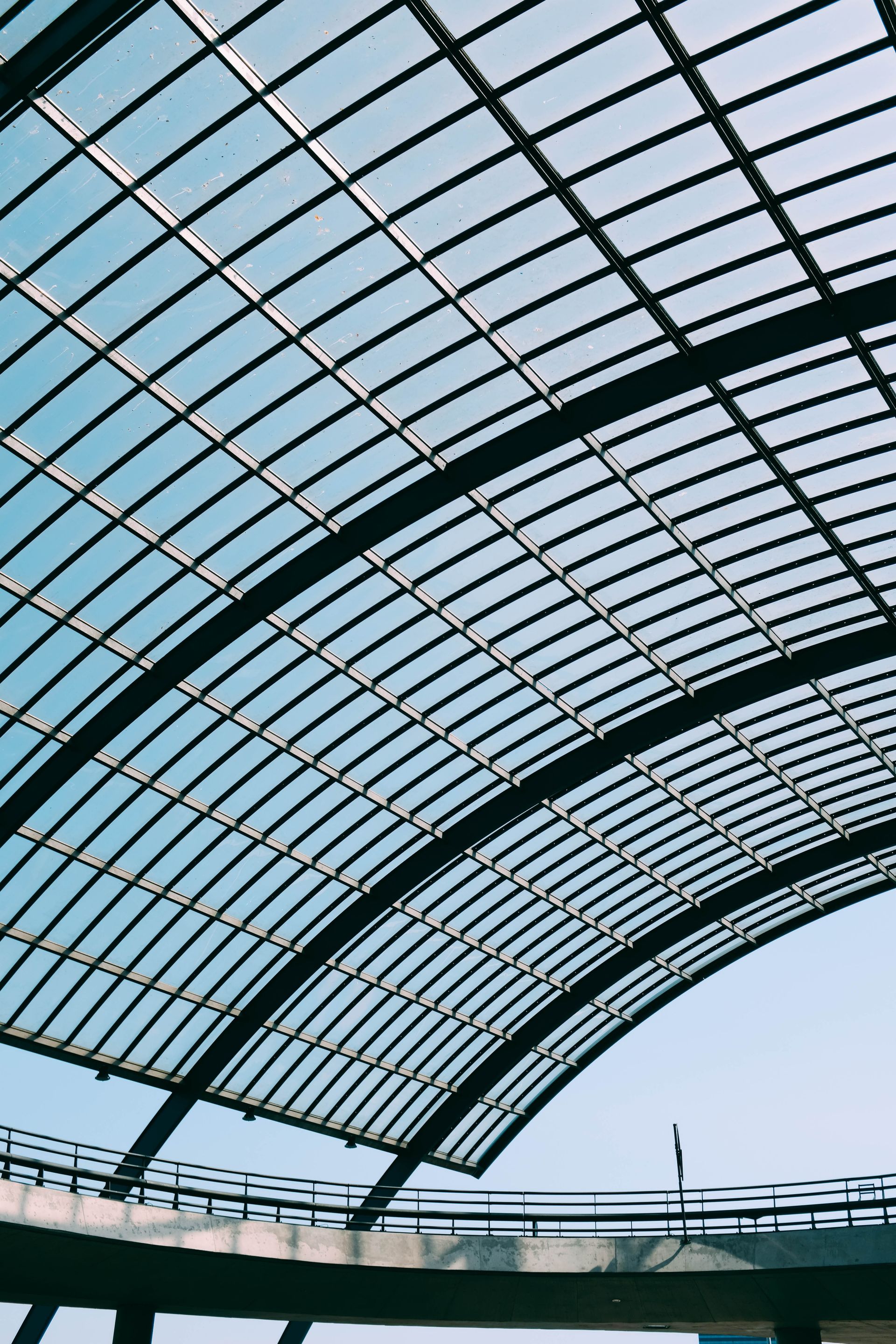 Looking up at the ceiling of a building with a clear glass roof.