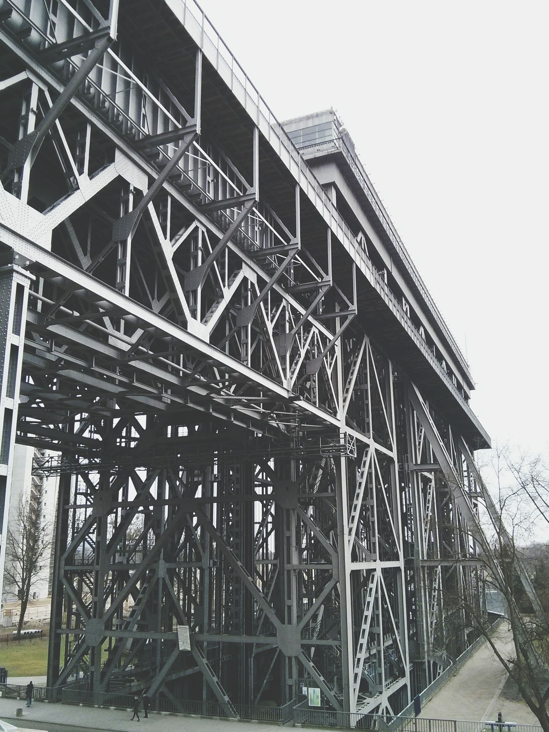 A large bridge with a lot of metal beams and stairs