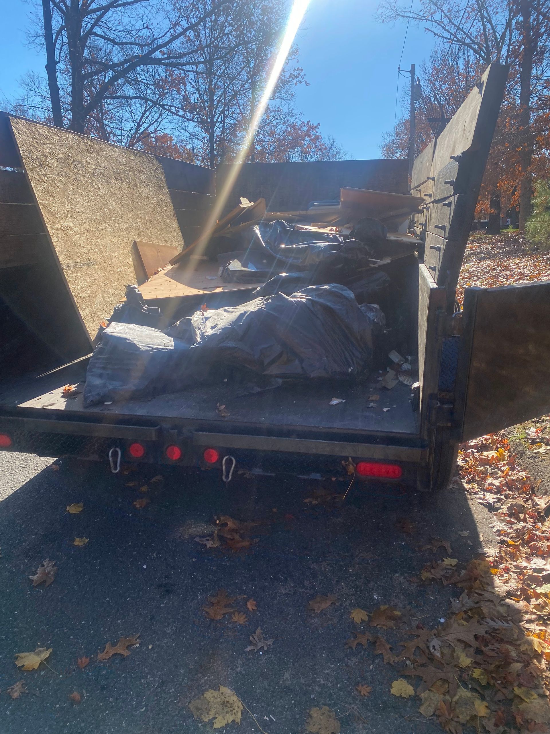 A truck with garbage in the back of it