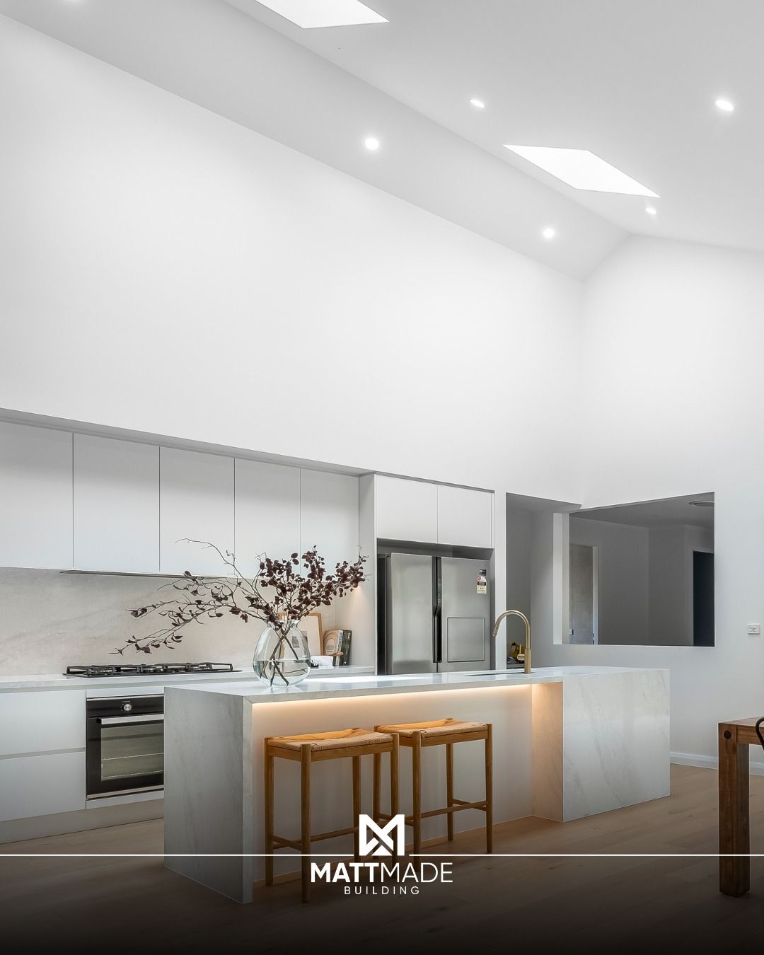 Modern white kitchen with island — Matt Made Building in Camden, NSW
