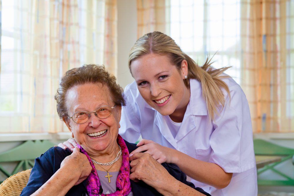 Happy Old Lady With Her Support Worker At Home — Aged Care in Yeppoon, QLD