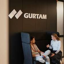 Two people sit under the 