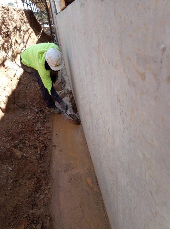 2. Install sloped corner joint to footings for water run-off