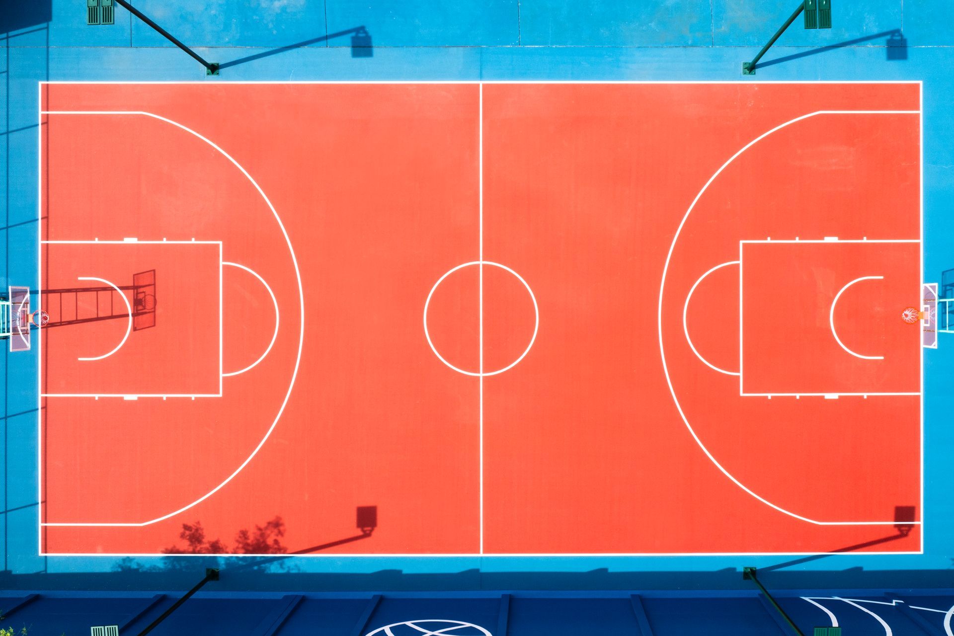 An aerial view of a red and blue basketball court.