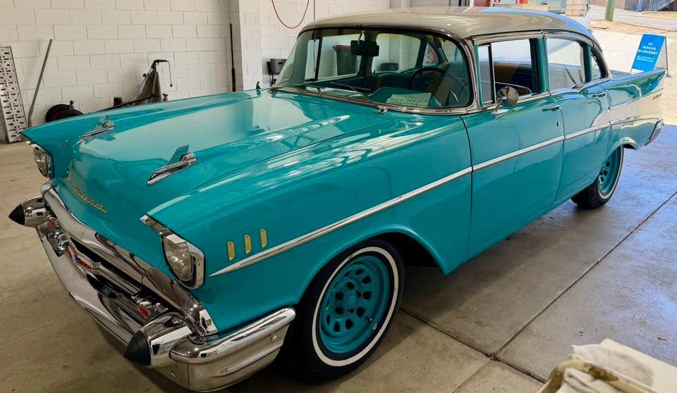 Teal and white 1957 Chevrolet Bel Air classic car.