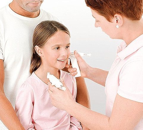 Woman pierces girl's ear while man watches. Girl smiles. White background.