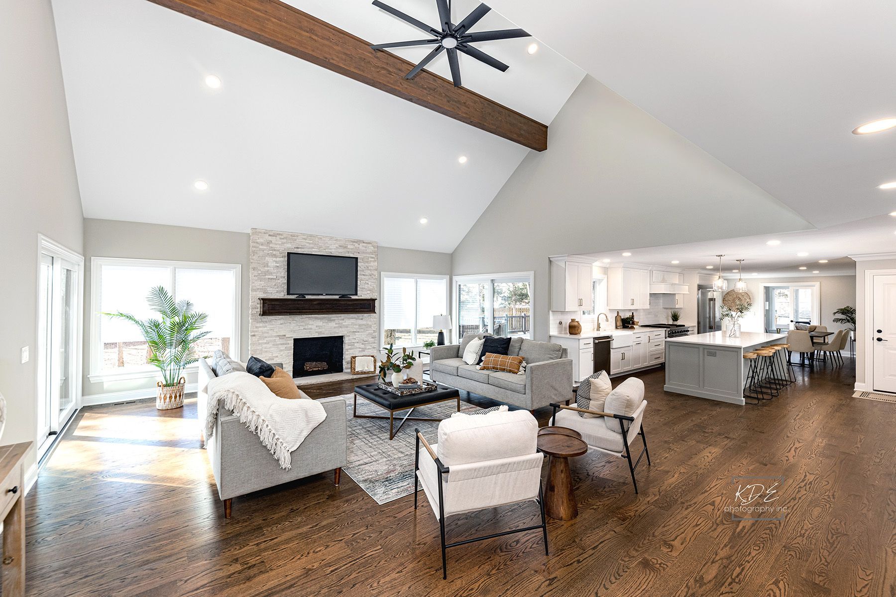 A living room filled with furniture and a fireplace.
