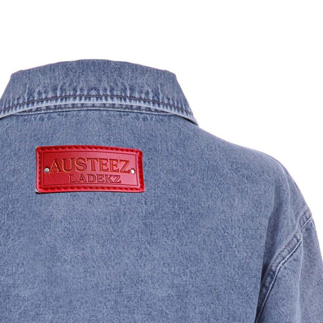 Light-blue denim jacket with artwork of a woman's face; text 