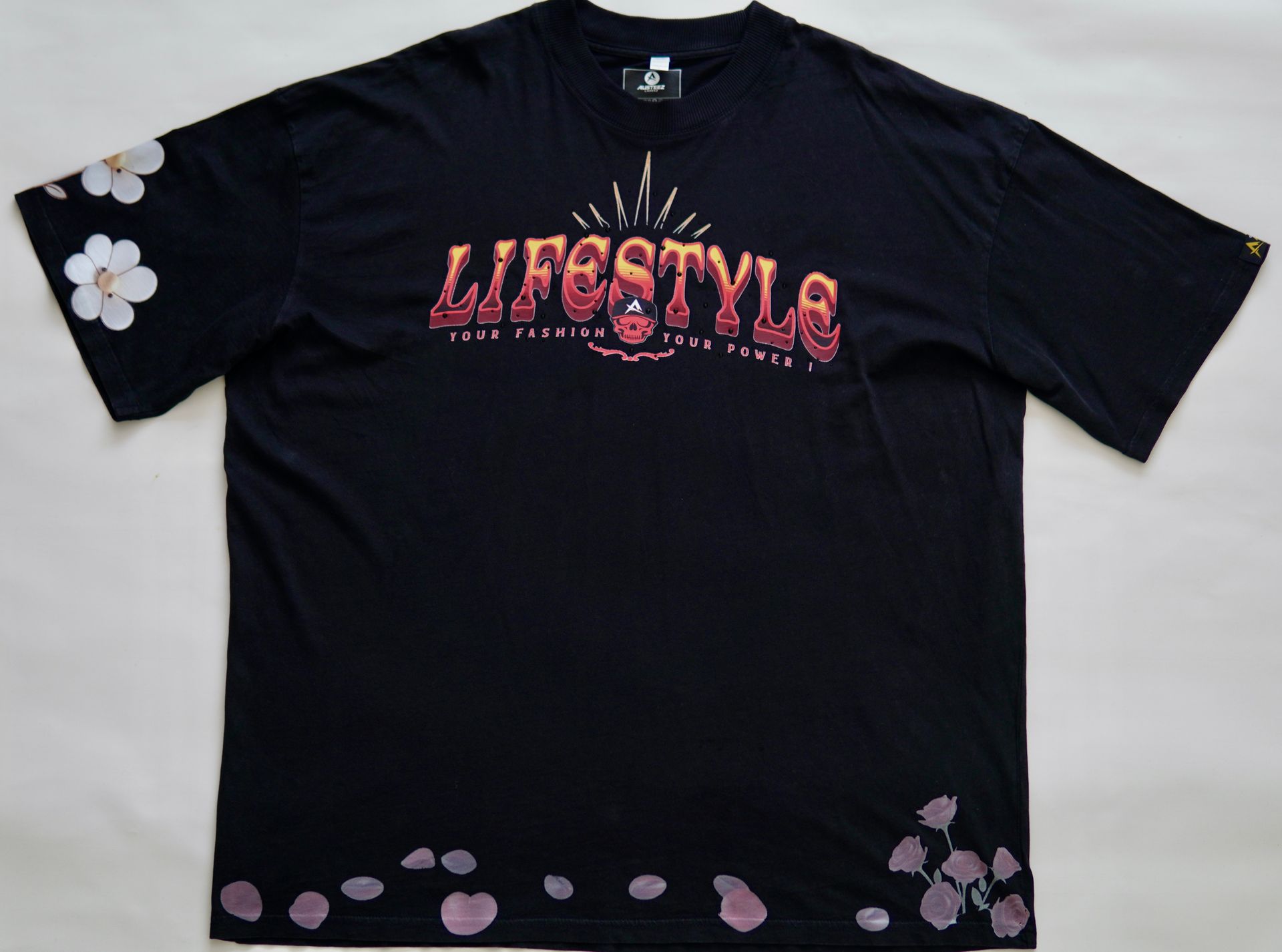 Front view of a Black Custom-made with gradient flame-style lettering, 3D rhinestone accents (bling), and soft floral prints on premium cotton. Featuring the Austeez Noble Family woven tag – made for those who live loud but love quiet.
Pre-release drop. Made in limited quantities.