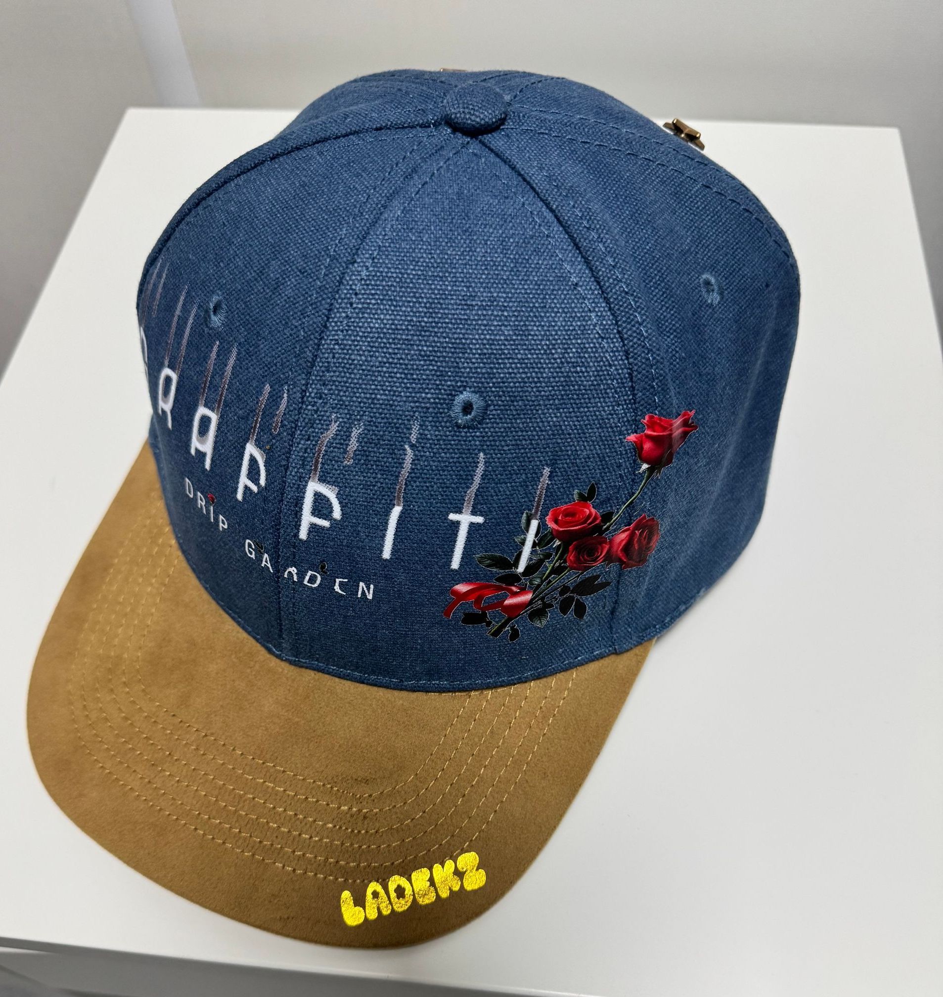 Blue and tan baseball cap with 