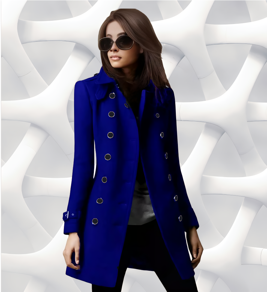 Woman in blue coat and sunglasses stands in front of a white geometric background.