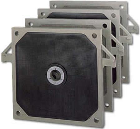 A stack of four filters sitting on top of each other on a white surface.