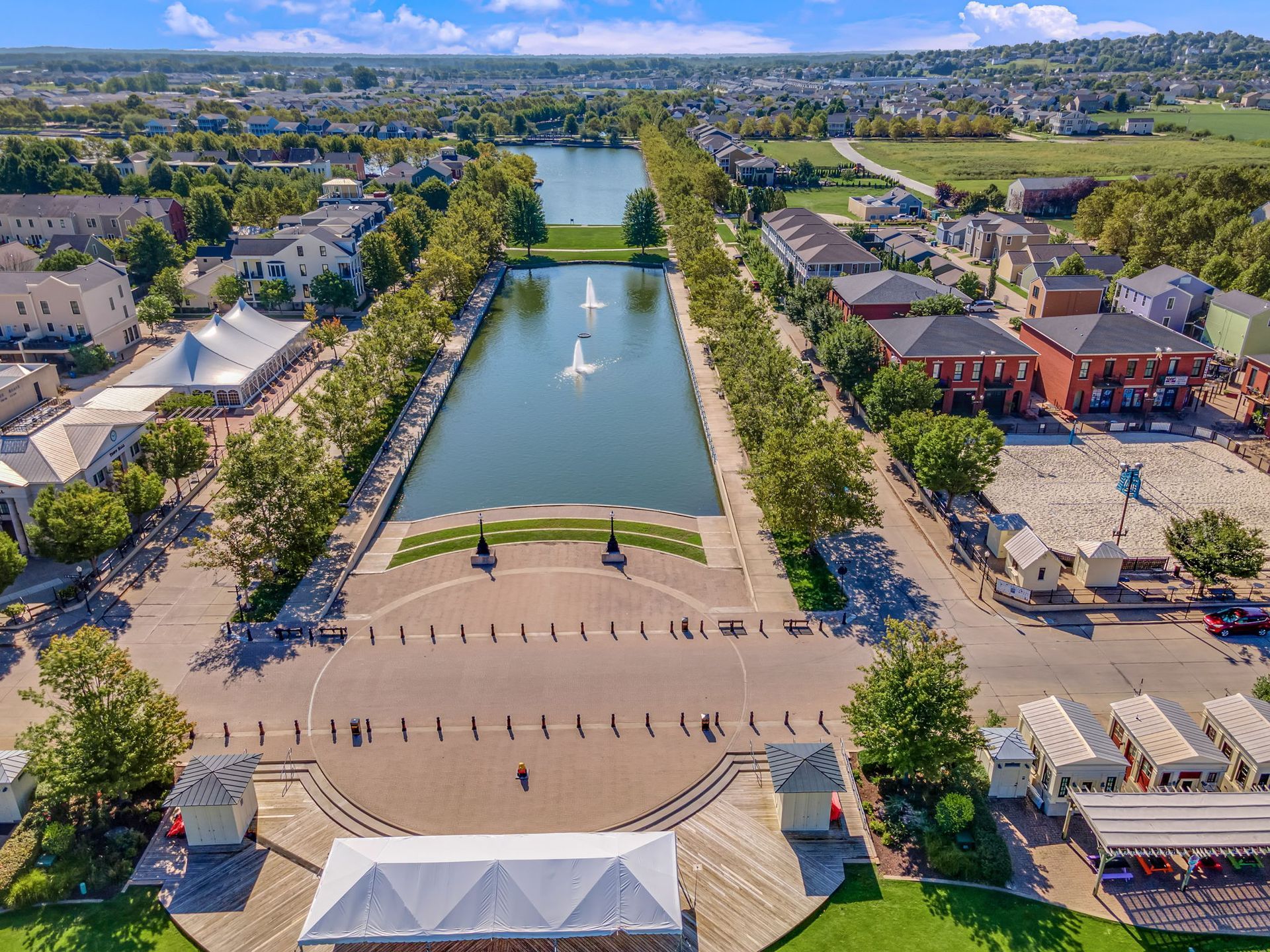 An aerial view of a city with a lake in the middle of it
