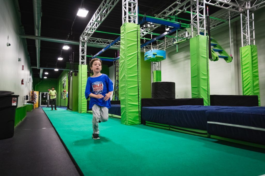 Young boy on the obstacle course