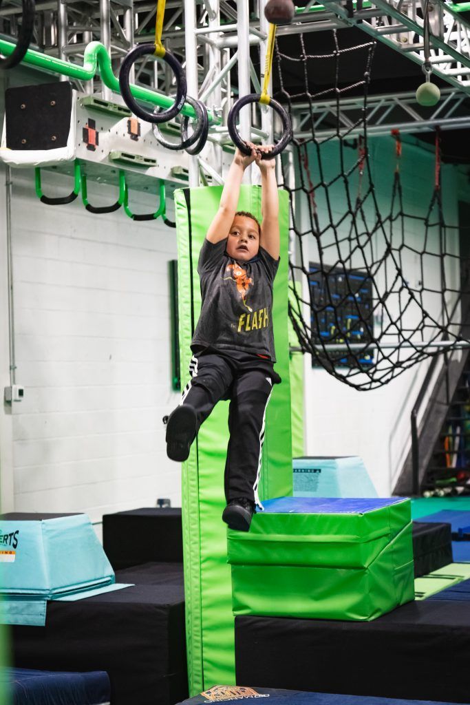 Swinging from bars at the Ninja Lab