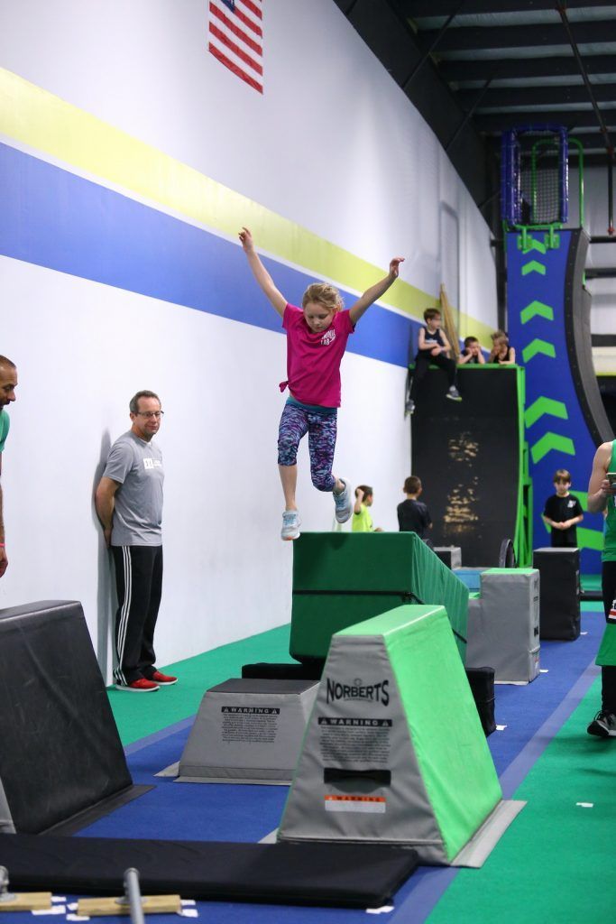 Young girl jumps at Ninja Lab