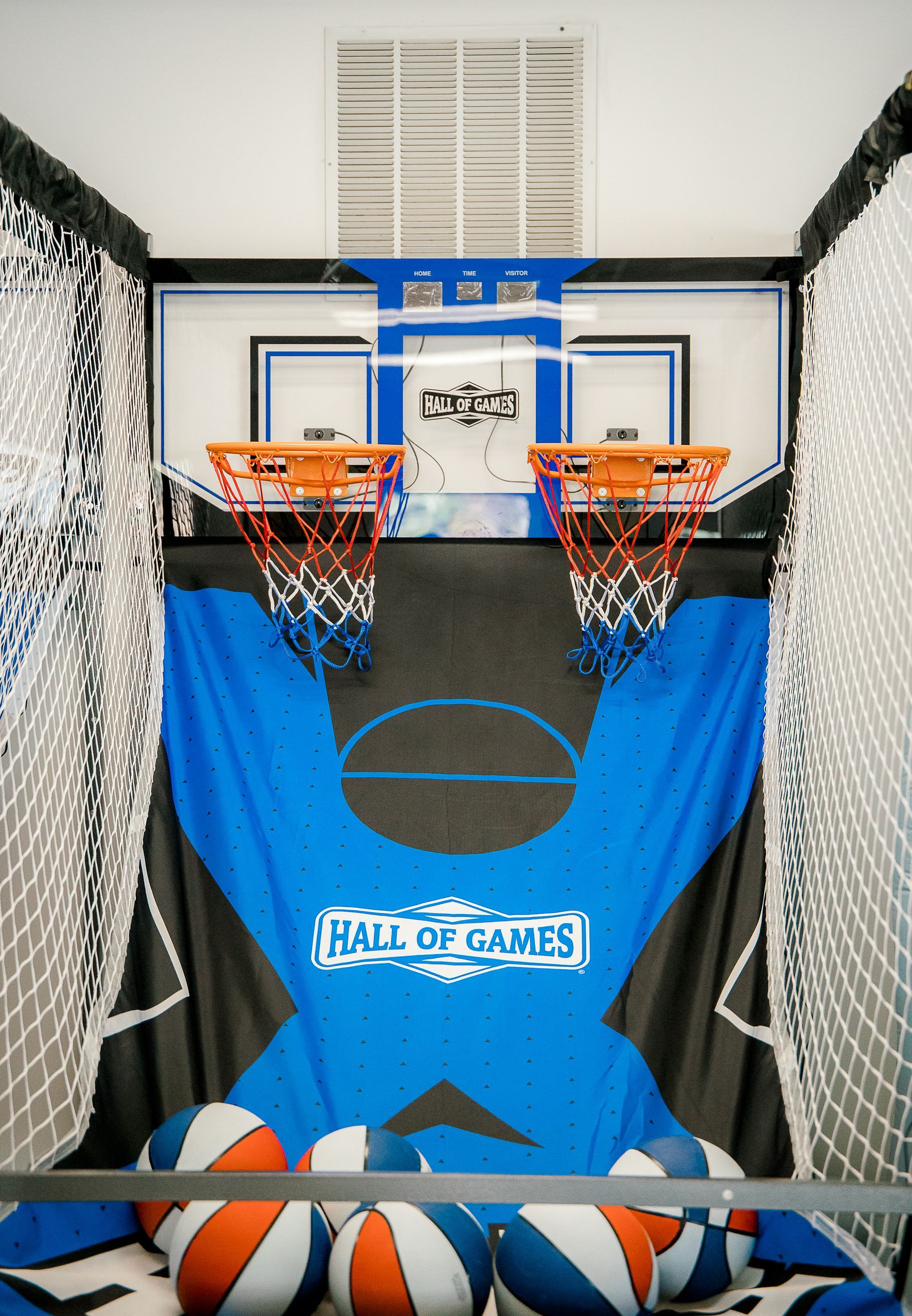 A basketball hoop game at The Lemon Lounge Indoor Playground.